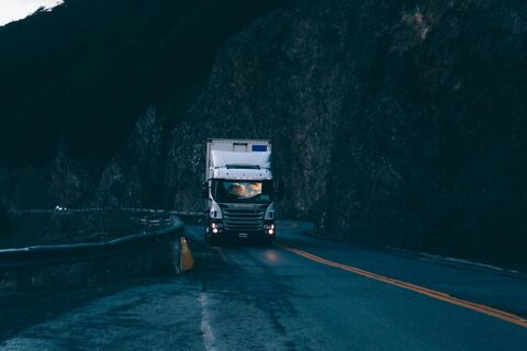 Heavy goods vehicle on a highway at dusk